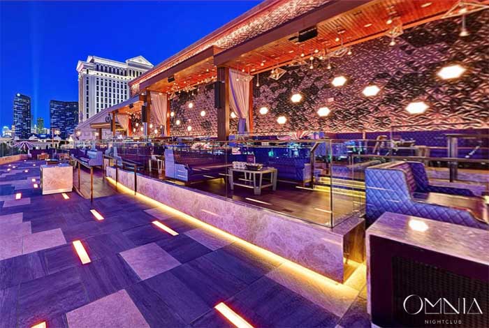A picture of Omnia's bottle service tables on the rooftop terrace