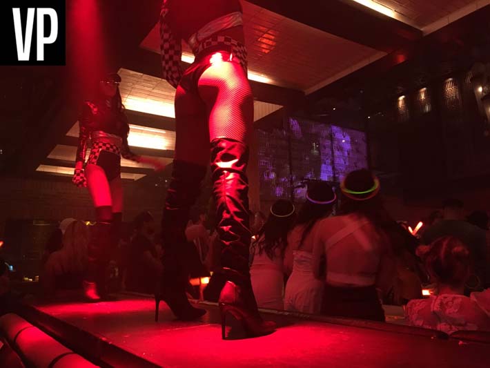 Go-go dancers perform on top of tables at Lavo Party Brunch