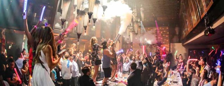 Guests standing on top of tables