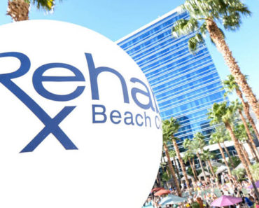 A large beach ball with the club in the background.
