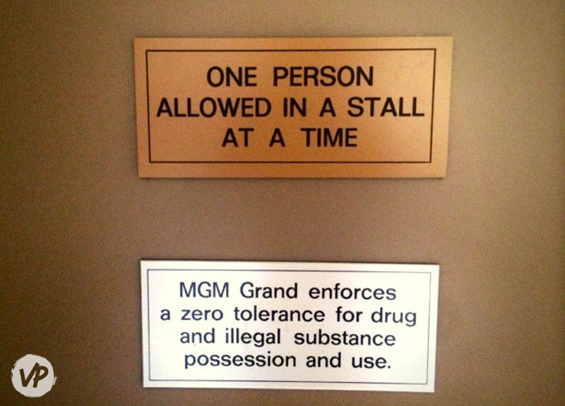 A no tolerance sign in a bathroom stall stating that illegal substances are not permitted.