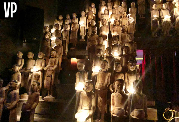 Statues are holding candles at Tao Las Vegas.