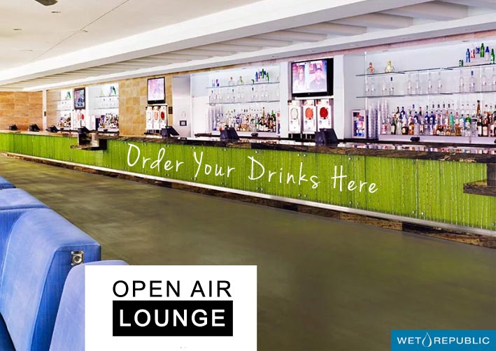 A photo of the open air lounge with Wet Republic's bar in the background