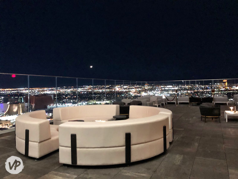 A photo of tables and firepits on the Legacy Club terrace