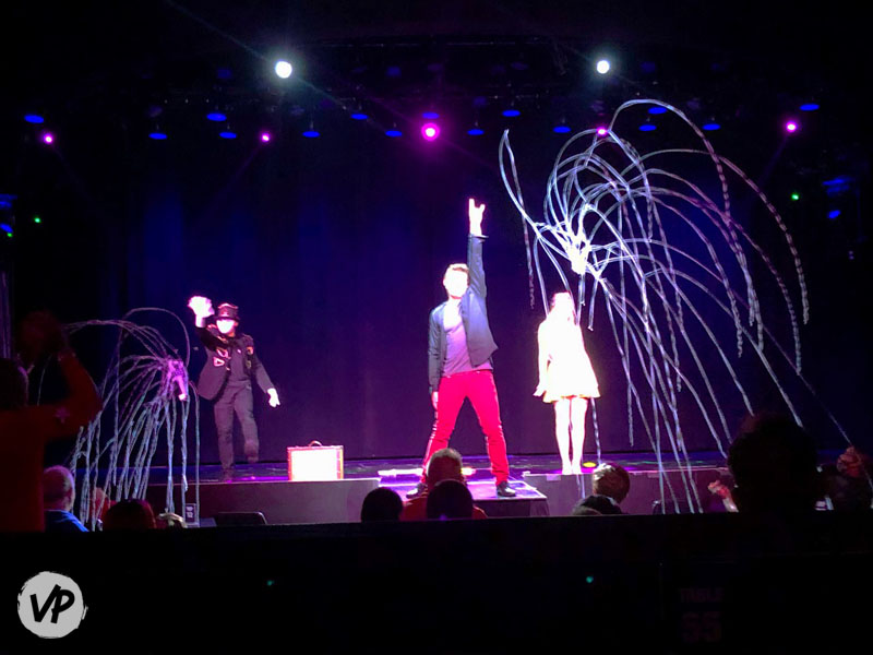 Xavier Mortimer performing an illusion on stage at The Dream Maker show