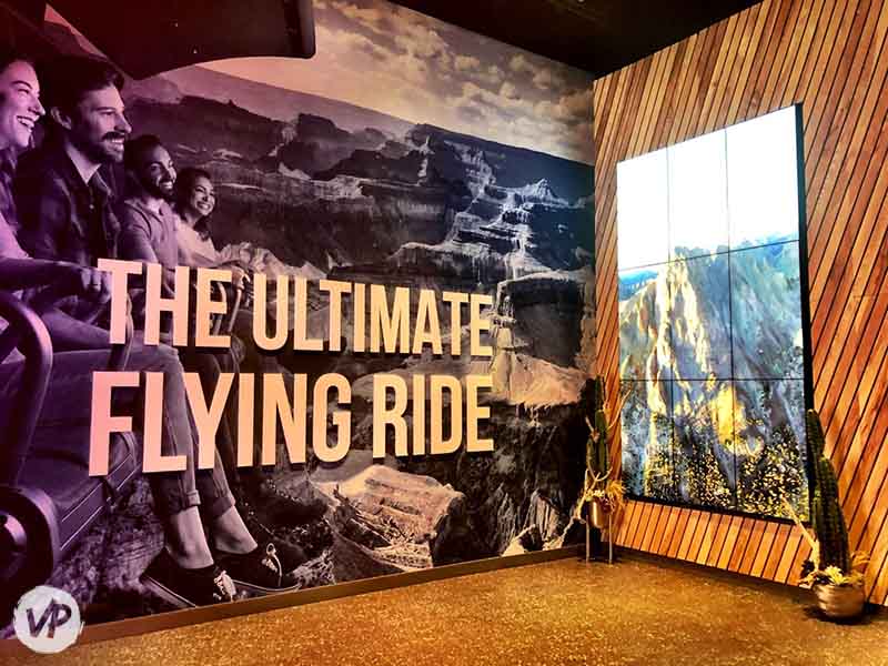 A large wall photo of the ride inside the Vegas Flyover attraction