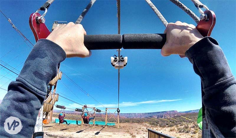 A photo showing how to brake on the zipline Grand Canyon