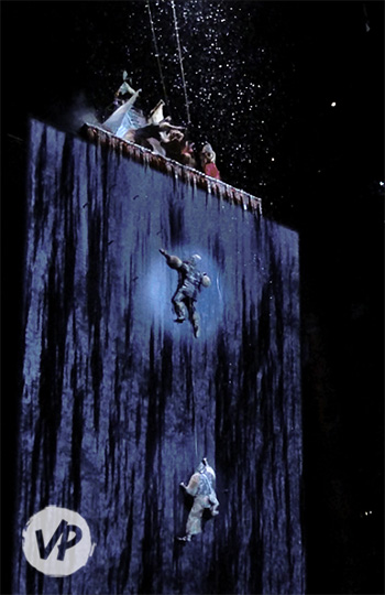 Cirque performers climbing a frozen mountain