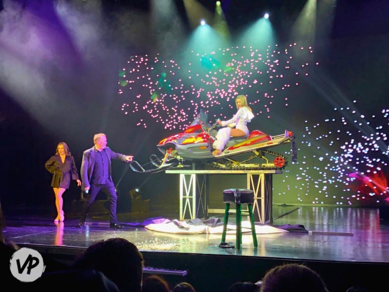 A jet ski appears onstage at a daytime magic show