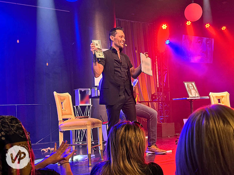 Frederic Da Silva on stage performing a mentalist act