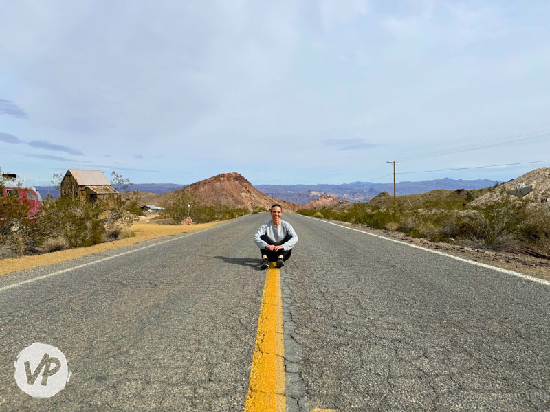 My friend sitting on the road